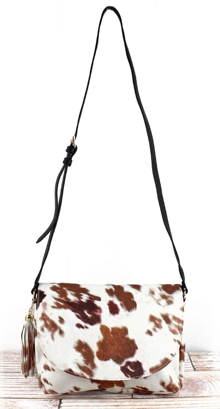 Cow print faux leather envelope crossbody
